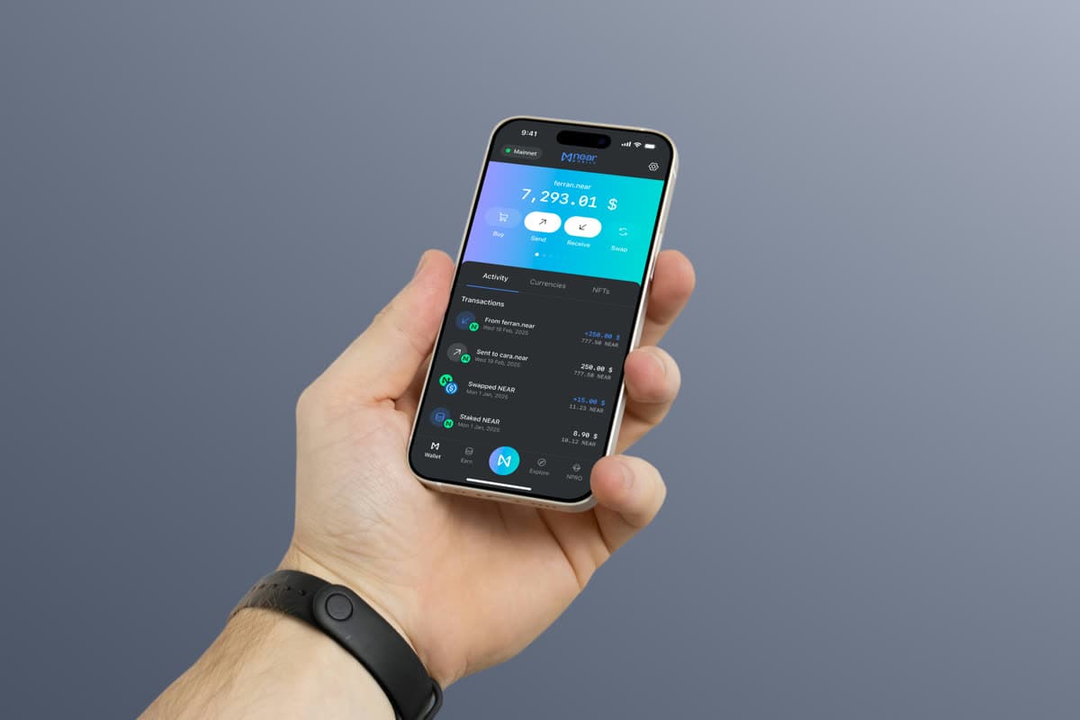 NEAR Mobile wallet in dark mode on a phone held in one hand