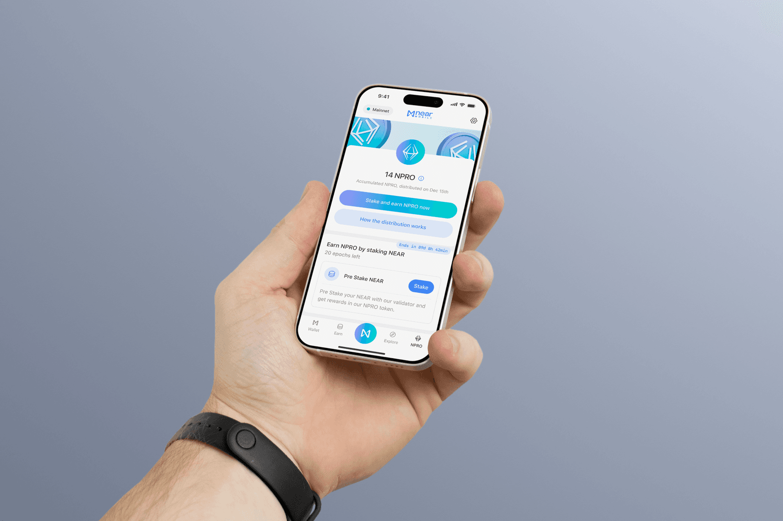 Hand holding a phone showing the NPRO screen inside NEAR Mobile